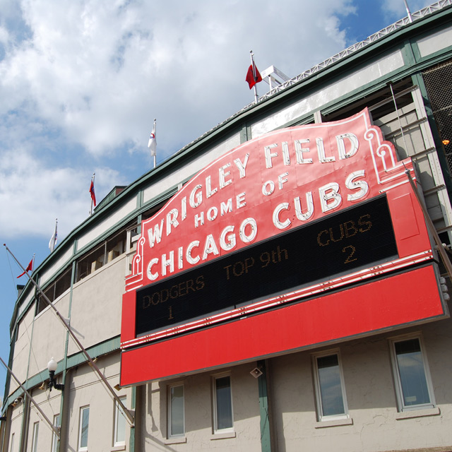 exterior of baseball stadium with Wrigley Field sign