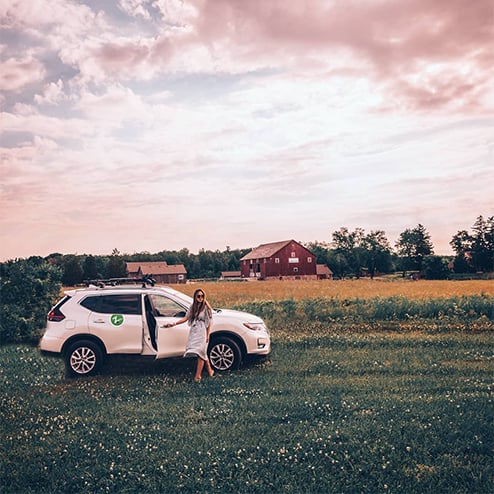 woman with zipcar in field