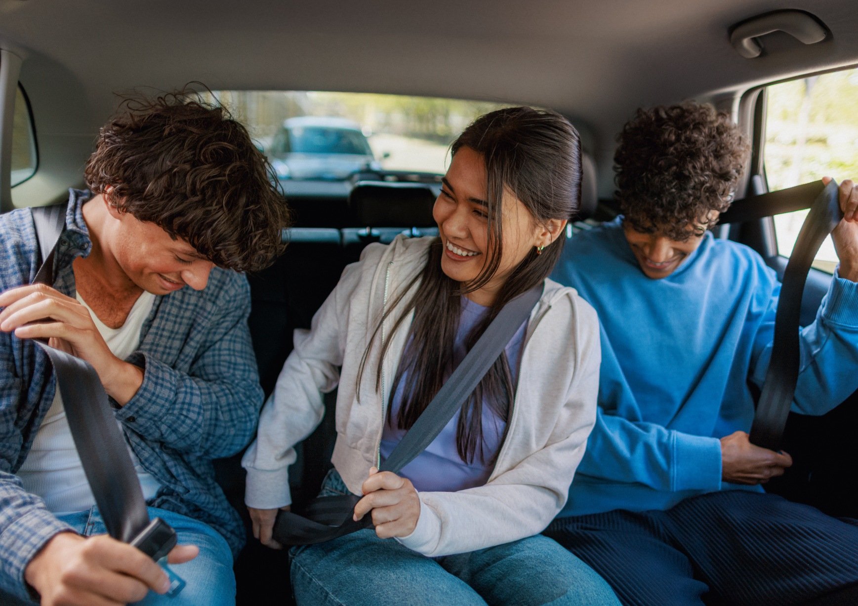  Friends using Car Sharing Vehicle In London
