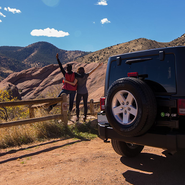 women hiking next to a Jeep in Colorado 