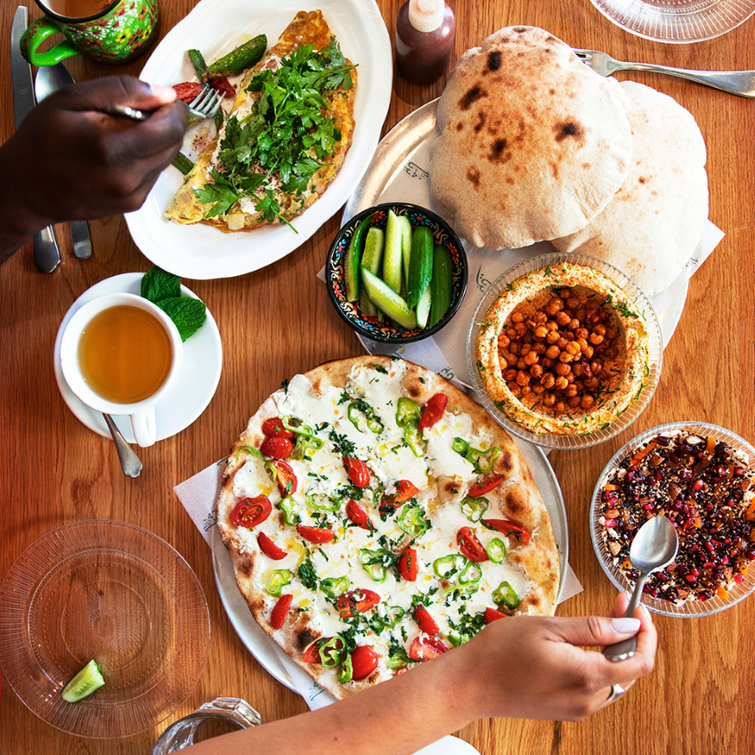 sampling a variety of foods on a table