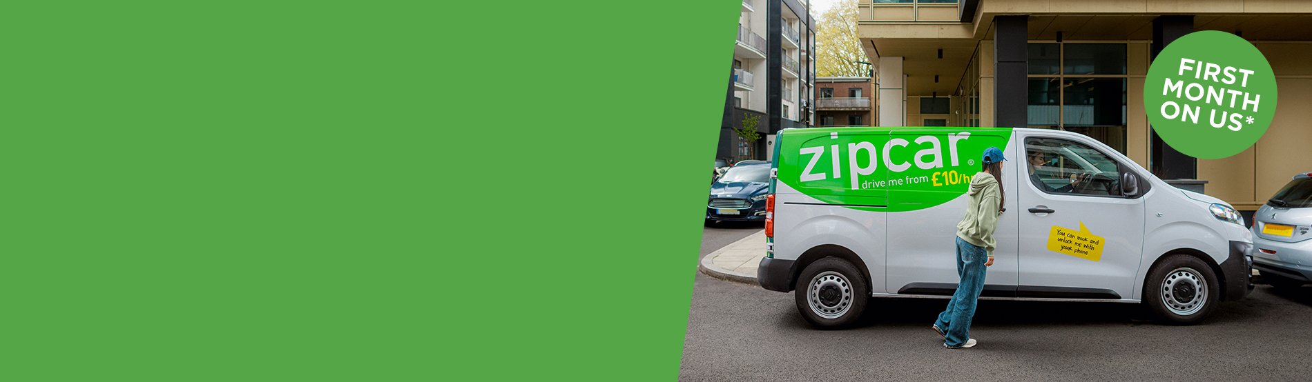Zipcar vans parked on a street