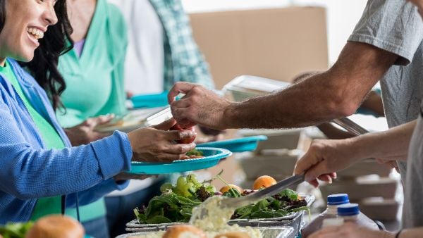 Volunteer serving food 