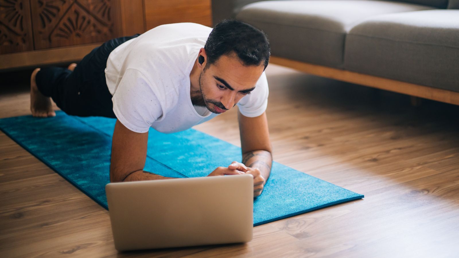 man doing online yoga 