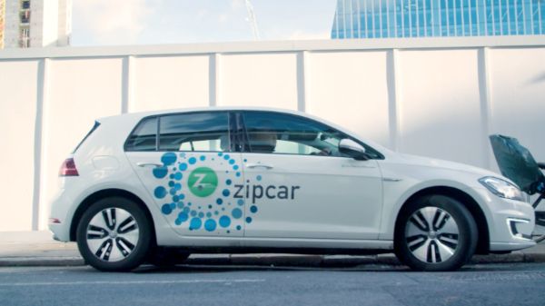 zipcar e-golf parked on a street