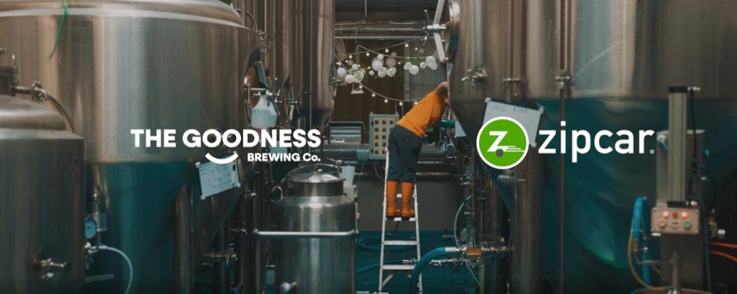 Inside a brewery with Zipcar and brewing company logo 